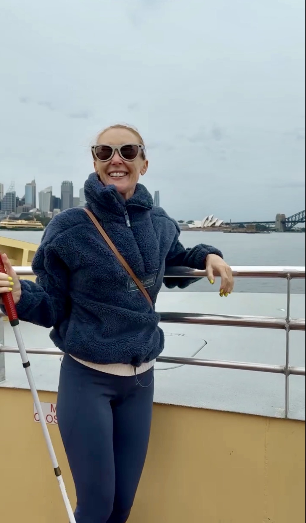 joanne posing on the ferry in Sydney with Harbour bridge